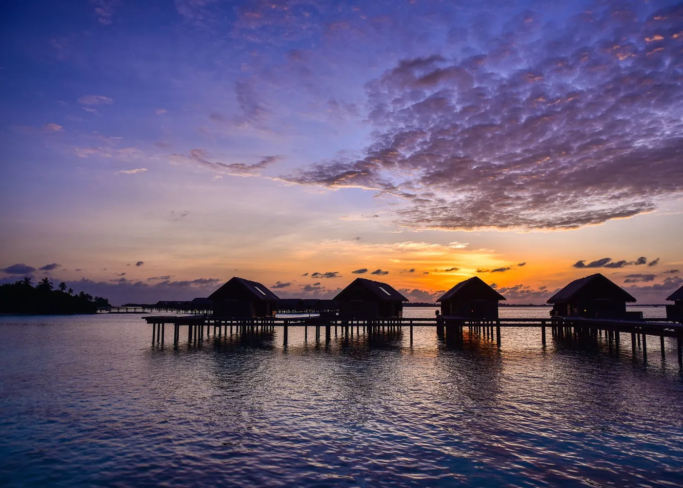 Overwater villas at sunset