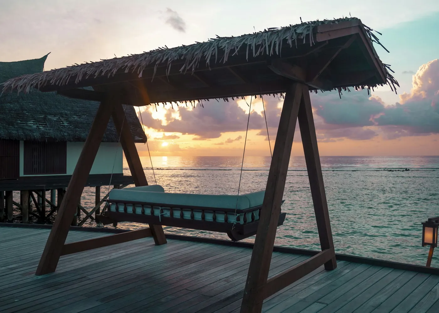Swing daybed over the water