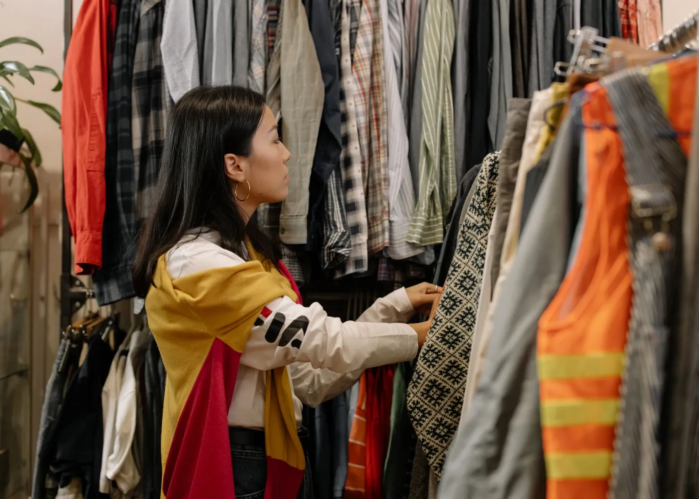 A rail of second-hand clothes waiting to be sorted