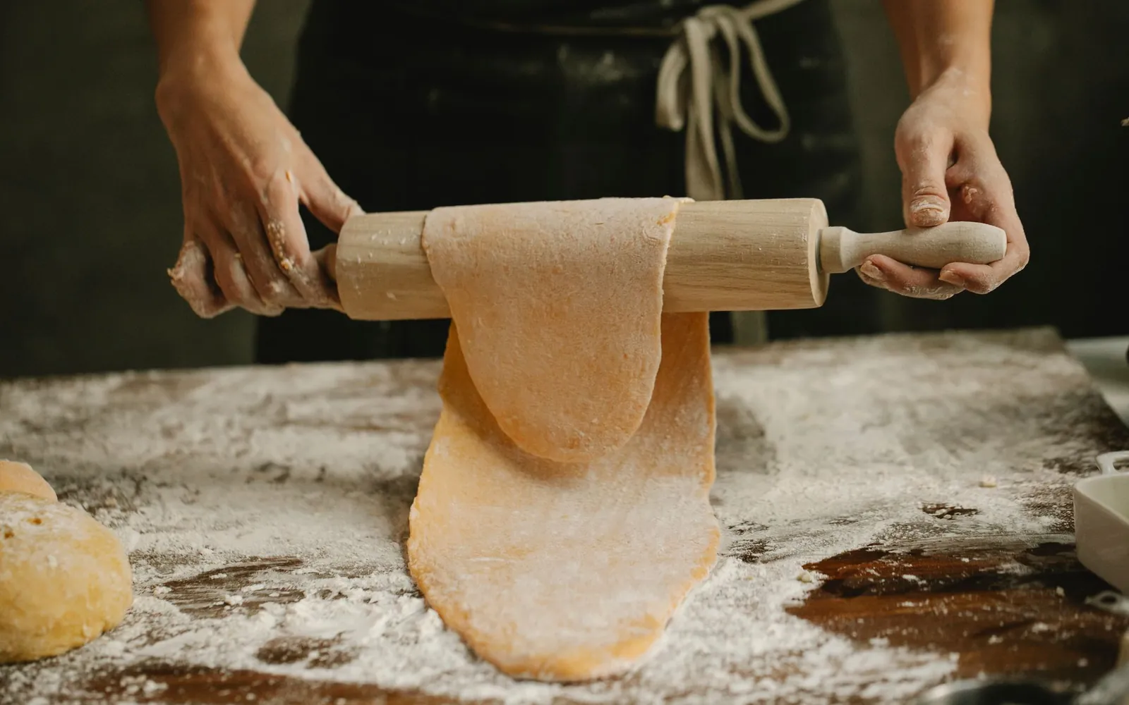 Fresh pasta dusted with flour on a board