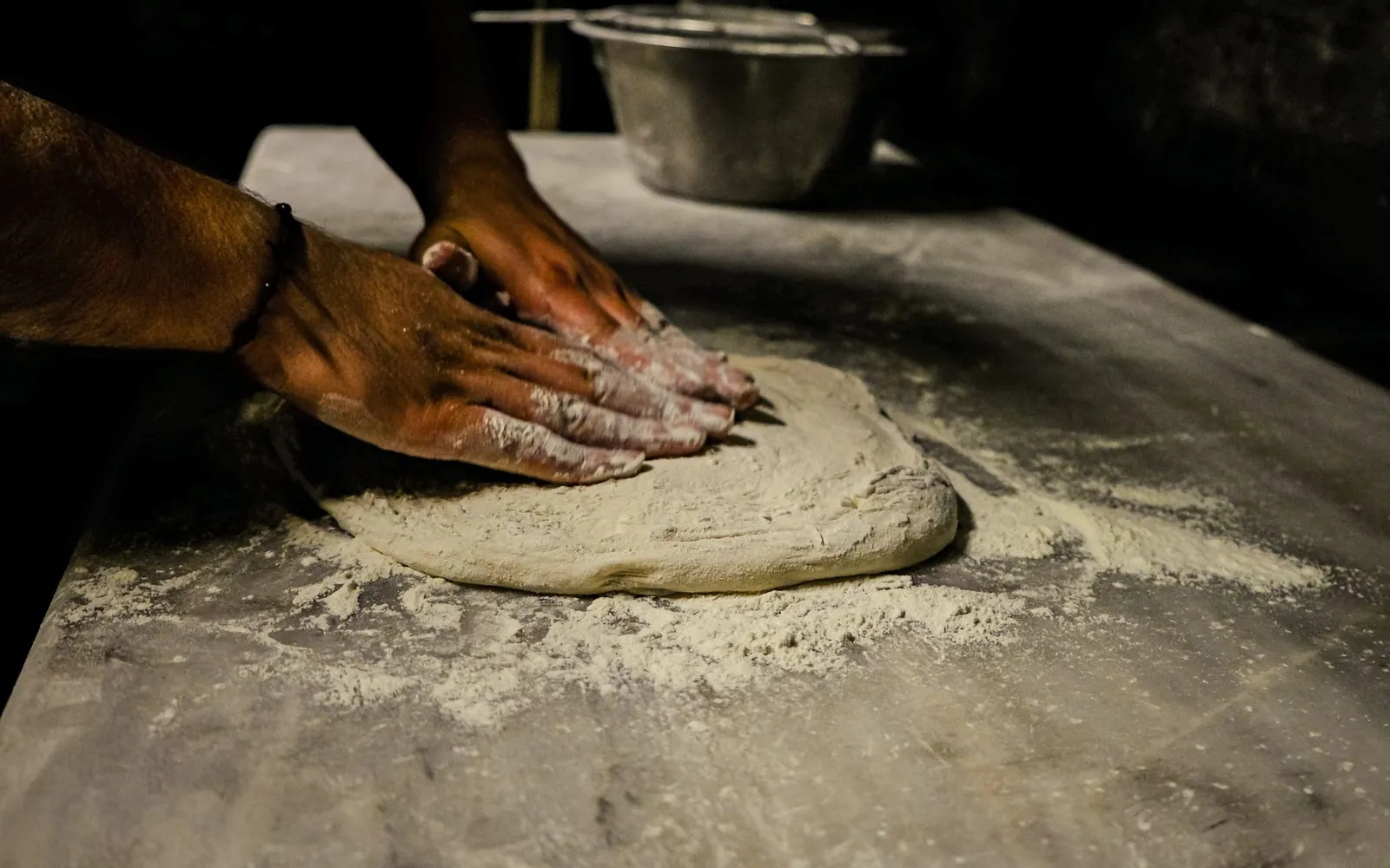 Dough being worked by hand