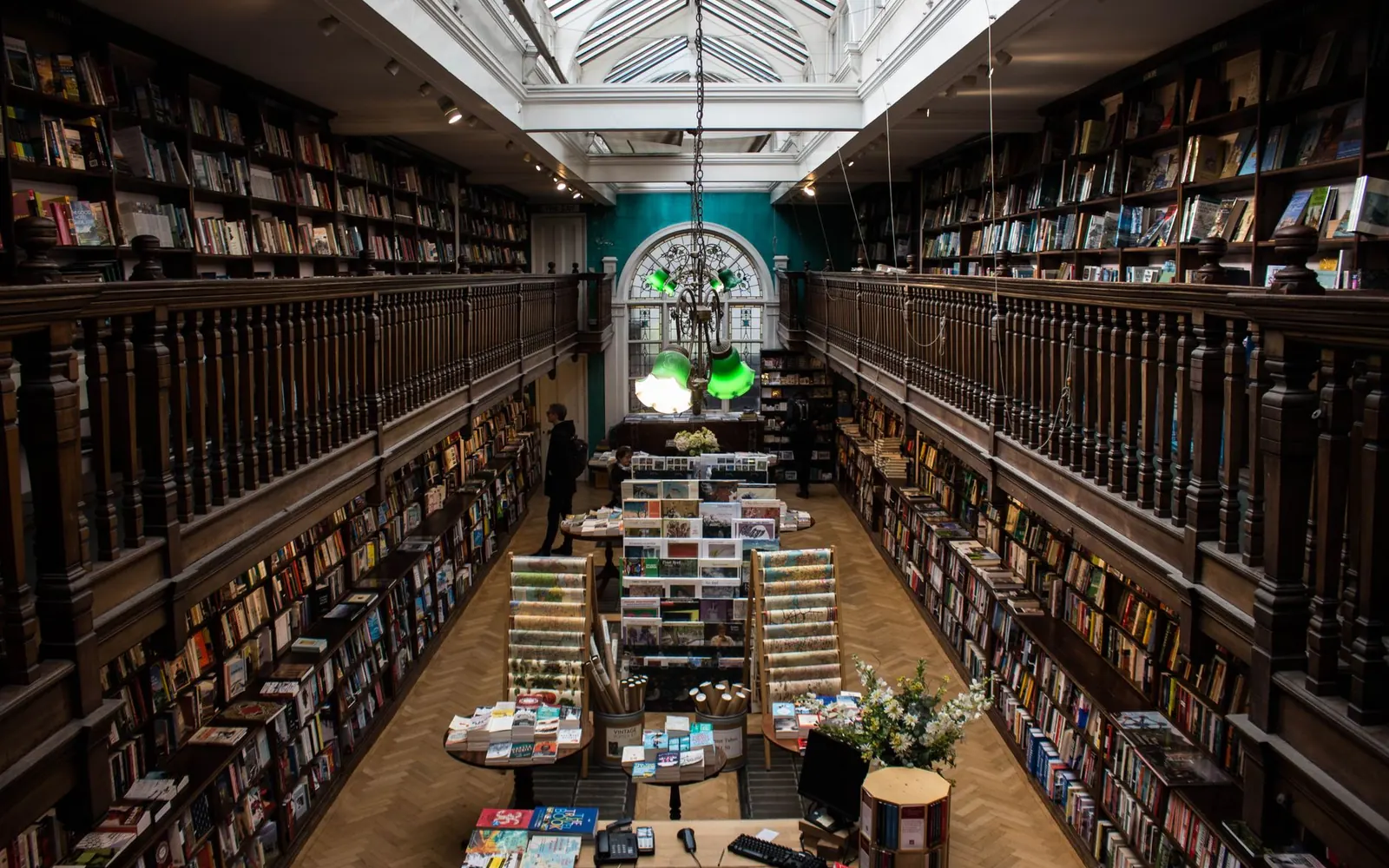 Inside the Pagewise shop: shelves of books under warm light