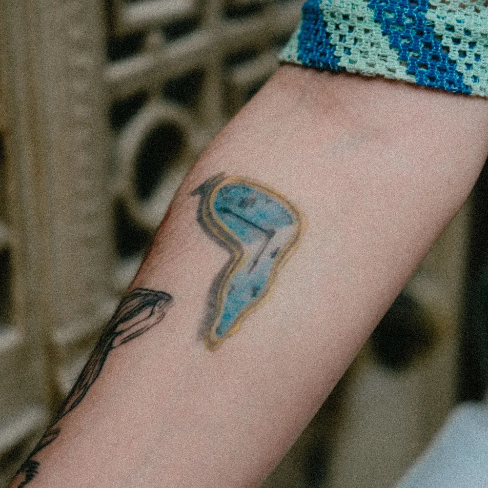 Blue wash, Watercolour tattoo on the Forearm by Isha Menon
