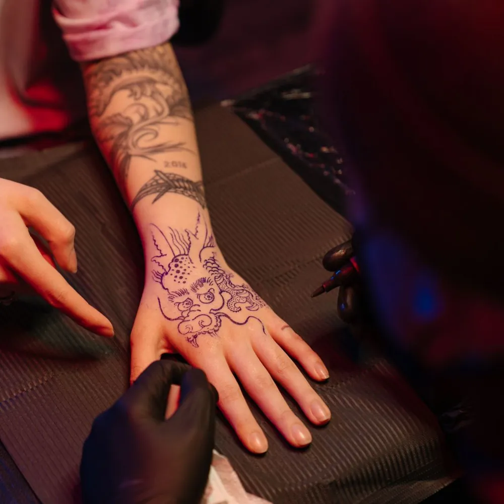 Red koi, Japanese tattoo on the Forearm by Yuki Arai