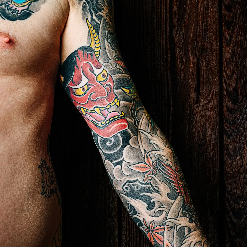 Red dragon, Japanese tattoo on the Sleeve by Yuki Arai