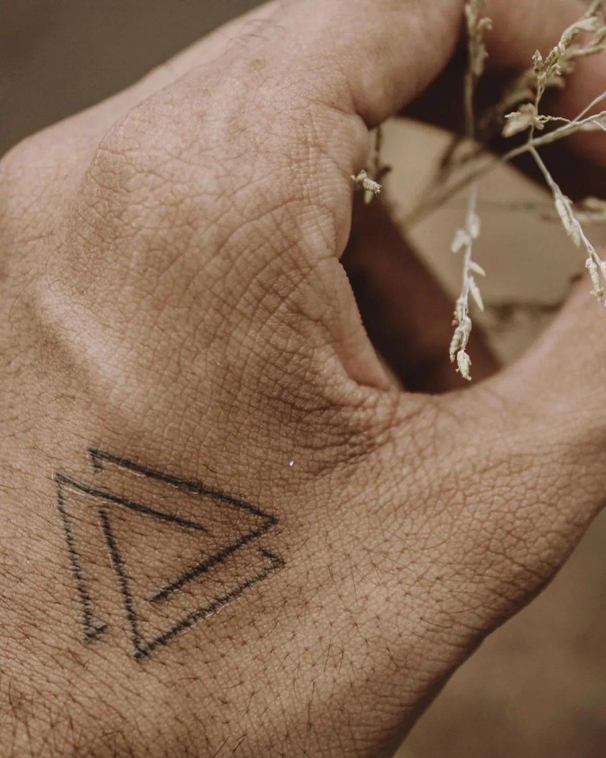 Nested triangles, Fine-line tattoo on the Hand by Mara D'Souza