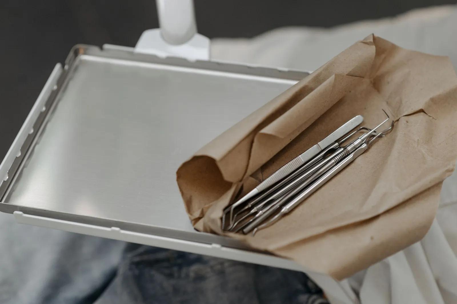 Sterile single-use needles and sealed cartridges laid out on barrier film