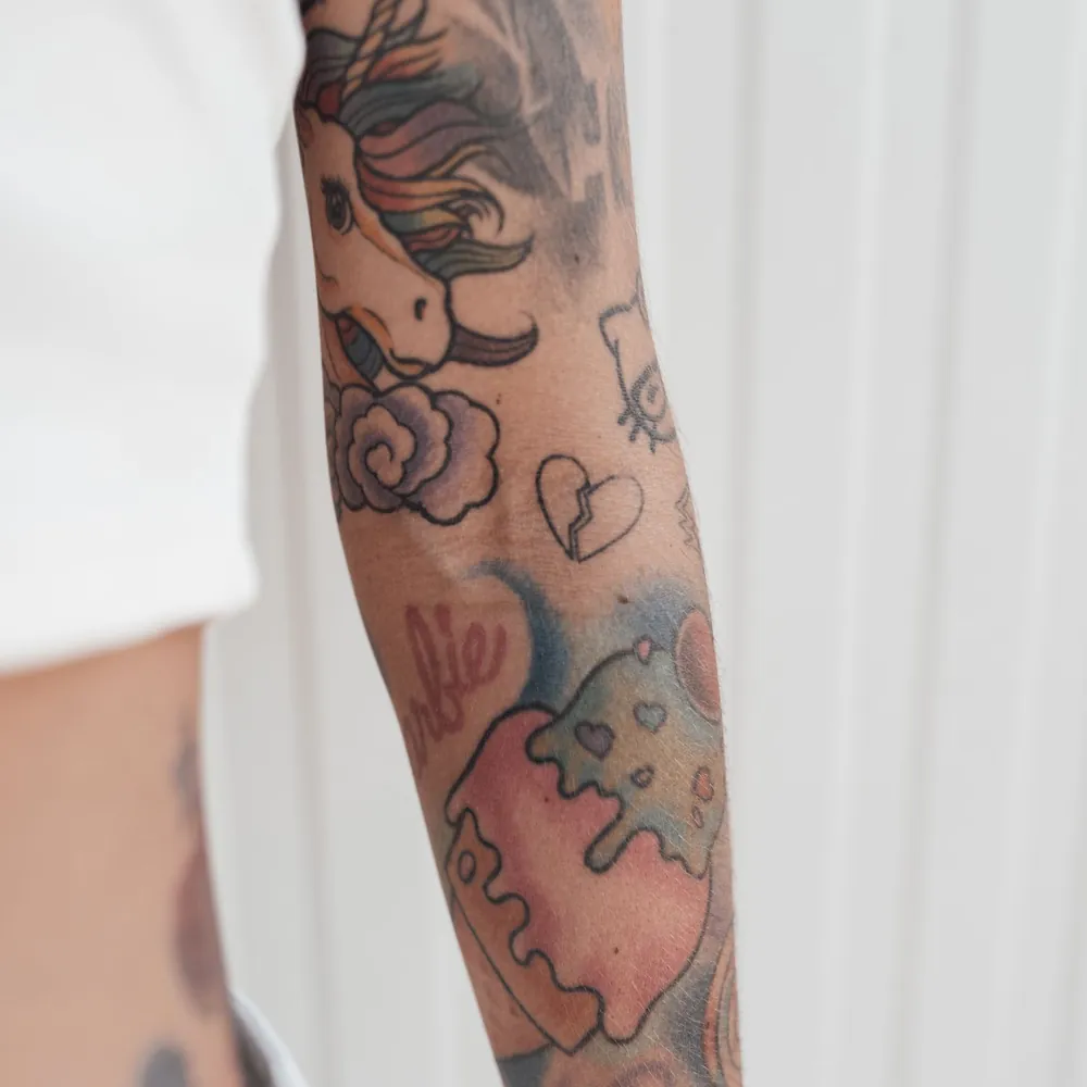 Red line florals, Fine-line tattoo on the Forearm by Isha Menon