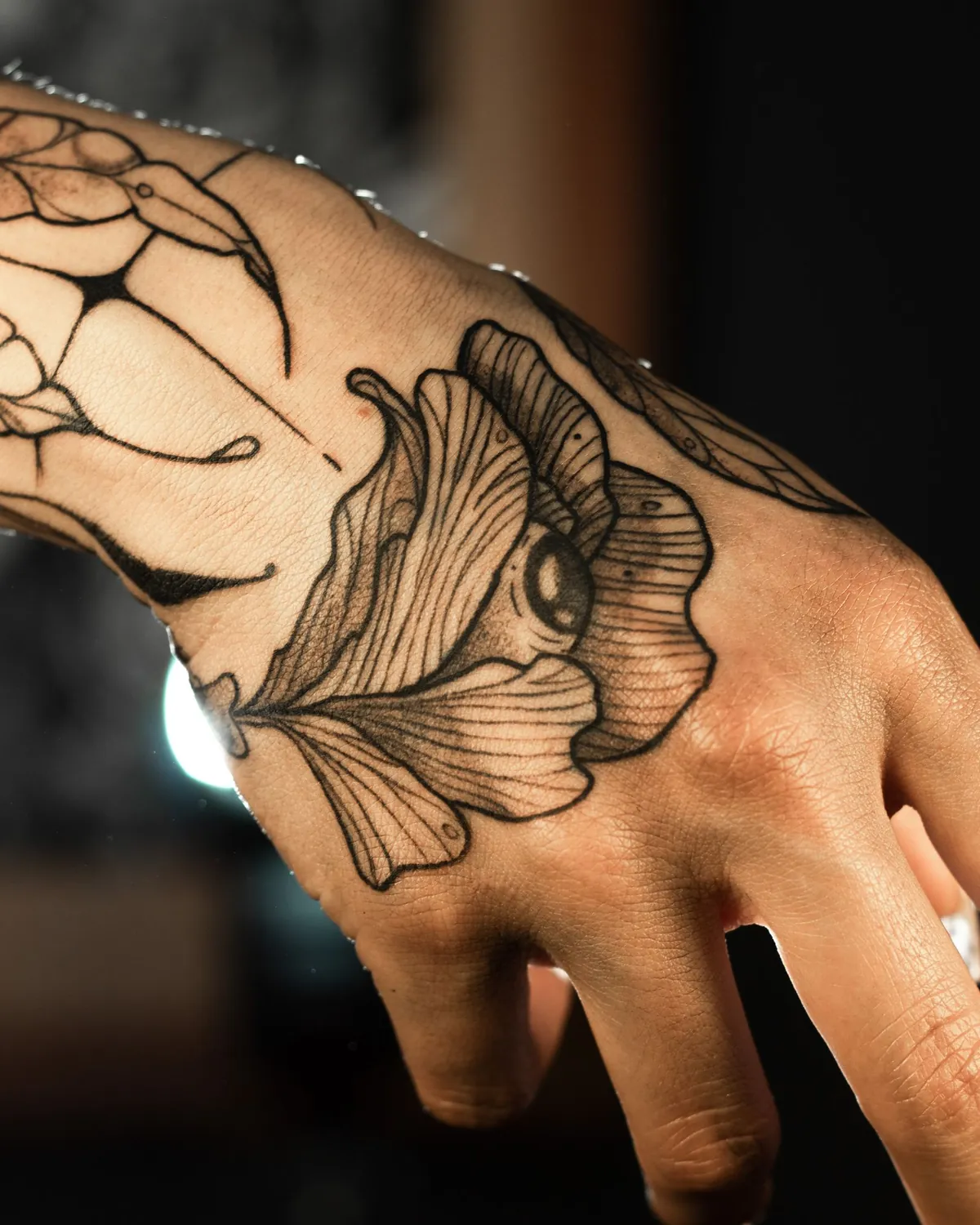 Poppy, Blackwork tattoo on the Hand by Kabir Rao
