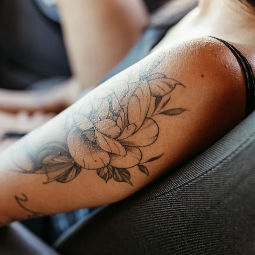 Peony study, Fine-line tattoo on the Forearm by Isha Menon
